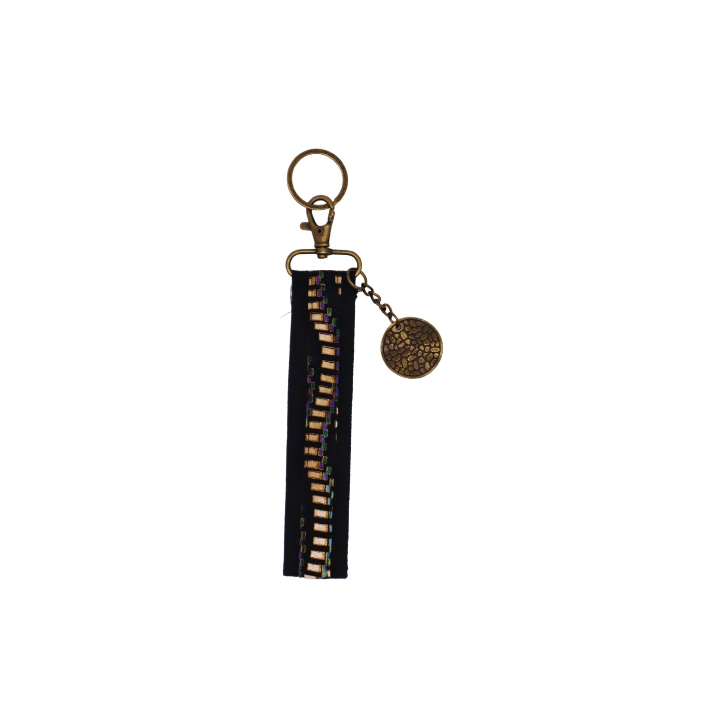 Llavero de algodón de color negro con estampado geométrico negro y violeta. Su medida es de 14 cm y por su diseño permite colocarlo en la muñeca.
